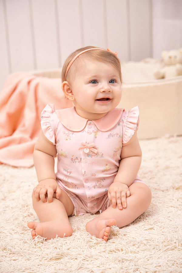 Macacão Curto Bebê Feminino Malha Conforto com Estampa de Fadinhas e Laço